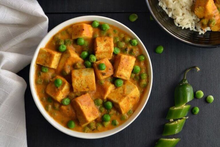 tofu matar paneer in a white bowl